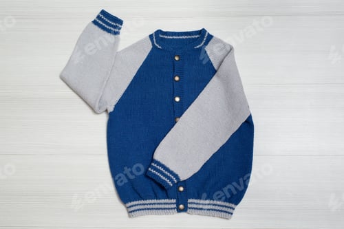 Preview: Knitted children's sweater on a white background