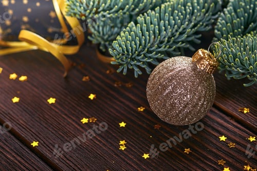 Preview: Christmas fir tree branches, Christmas balls, gift box, wooden snowflakes and stars on old brawn woo