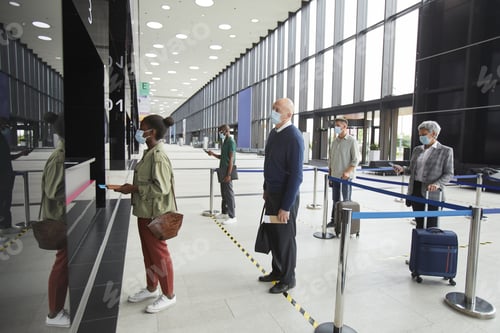Preview: People keeping the social distance at the airport