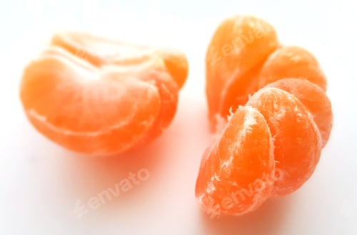 Preview: Juicy mandarine, split on half on a white background (nominated on Jan 2)