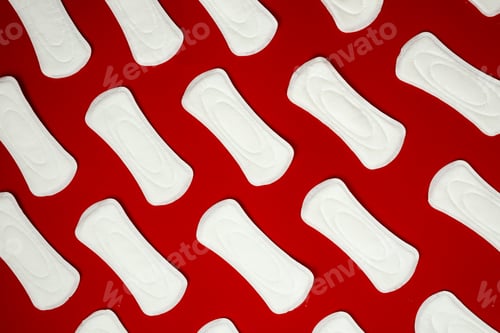 Preview: Hygienic female pads on red background, menstruation.