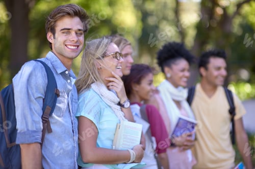 Preview: Excited about college. A group of students standing in a line on campus.