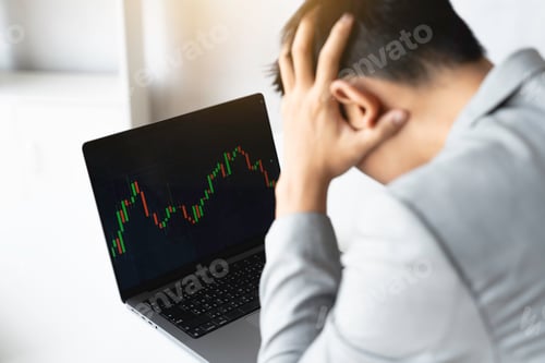 Preview: Businessman trading stocks with laptop talking about forex on laptop screens of stock market investm