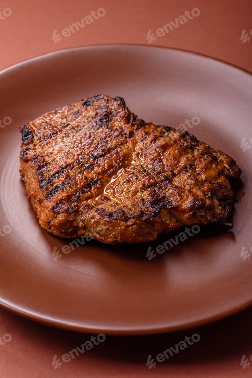 Preview: Meat, steak, beef tenderloin cooked on grill. Juicy steak as a food background