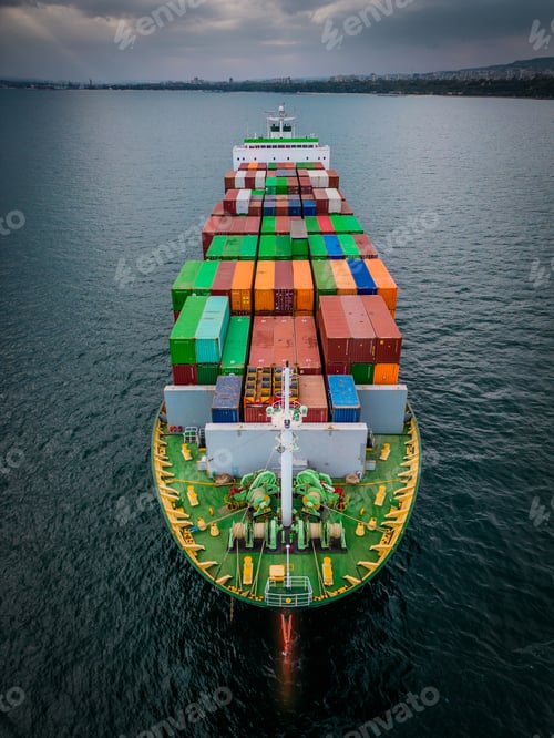 Preview: A loaded container ship in the sea, aerial view, concept of international trade and shipping