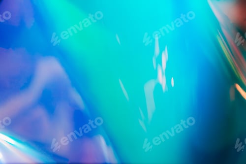 Preview: Photo texture of a fashionable holographic film. Abstract colorful holographic futuristic texture