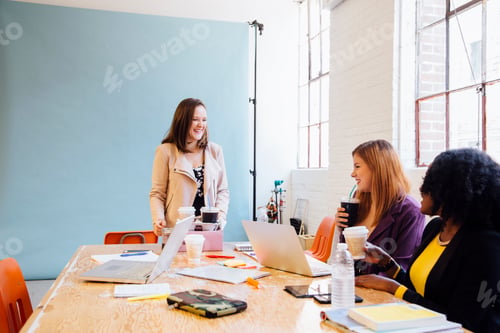 Preview: Colleagues in industrial office building working at desk
