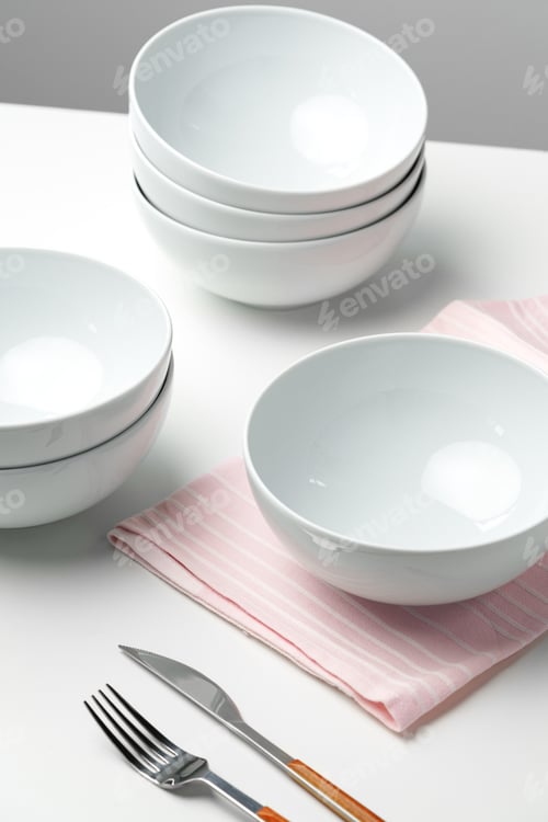 Preview: Stylish table setting with white dishware on white tablecloth