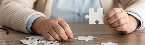 Preview: panoramic shot of retired woman with alzheimer holding puzzle piece