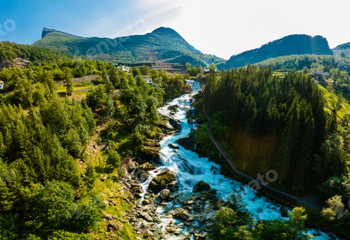 Preview: View of the river Geirangerelvi and the waterfall Storfossen in Geiranger, Norway.
