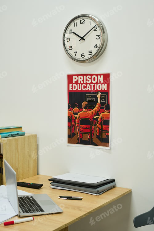 Preview: Wall Clock Hanging above Prison Education Poster in Modern Office Setting