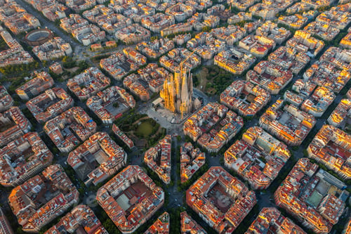 Preview: Aerial view of Barcelona Eixample residential district and Sagrada Familia Basilica at sunrise