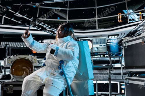 Preview: Smiling astronaut doing remote videocall with command center on Earth