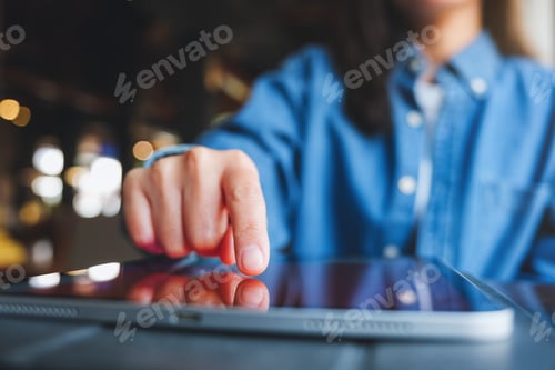 Preview: Closeup image of a hand touching on digital tablet screen