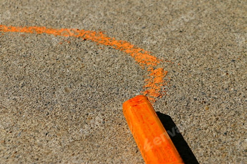 Preview: Orange sidewalk chalk line drawn on sidewalk.