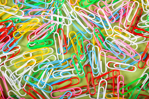 Preview: Paper Clip Lying On The Table Background Image