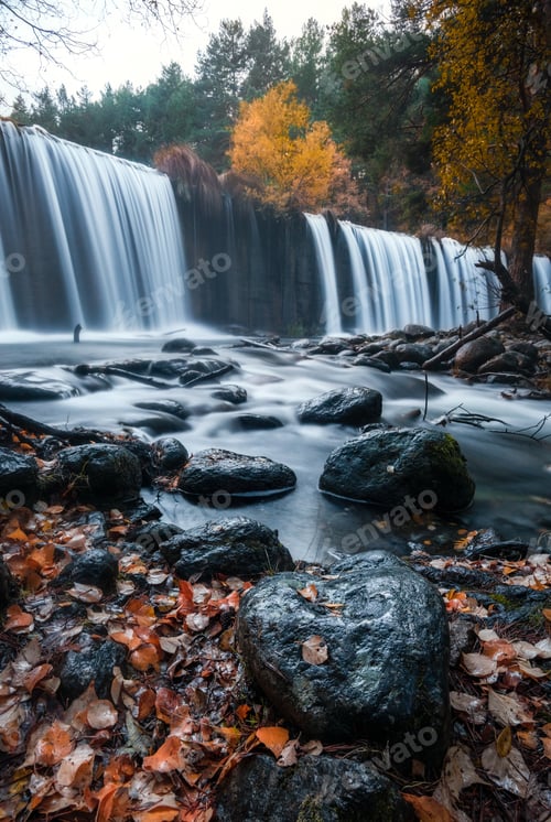 Preview: Amazing waterfall between autumn forest