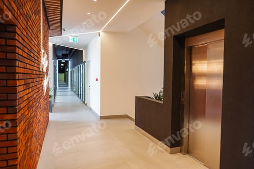 Preview: Long Hallway With Metal Door and Planter