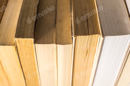 Preview: Many stacked books with white background with space