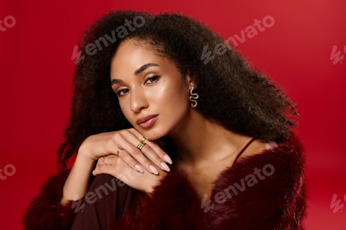 Preview: Trendy autumn fashion by a beautiful African American woman in a vibrant studio setting