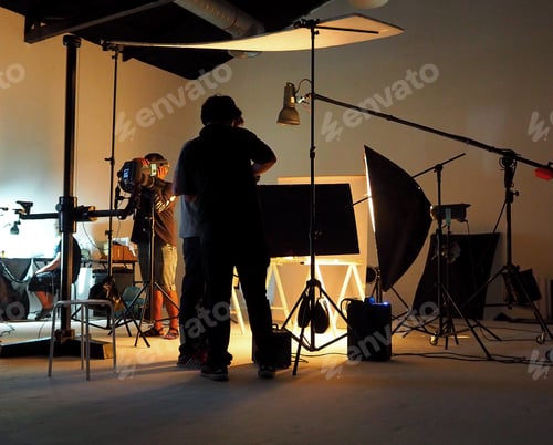 Preview: Silhouette of people working in production studio.