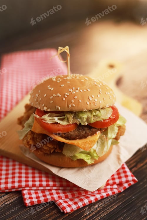Preview: Delicious homemade beef burger on wooden table.