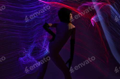 Preview: Beauty Fashion woman neon lines light posing studio model unaltered