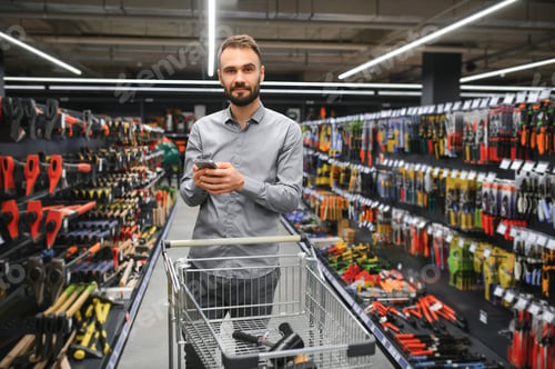 Preview: male builder in a hardware store