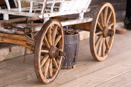 Preview: old wooden wheels are on the carriage at the ranch