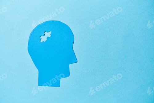 Preview: Alzheimer's disease, senile dementia and memory loss. Head silhouette with jigsaw puzzle