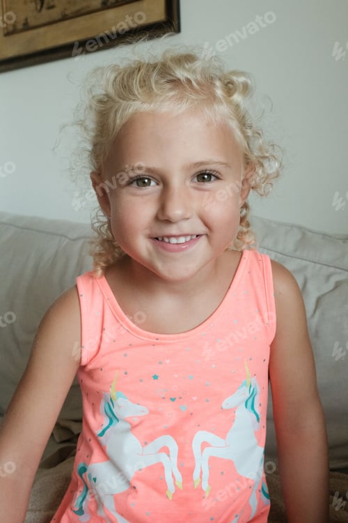 Preview: Delighted preteen girl in living room