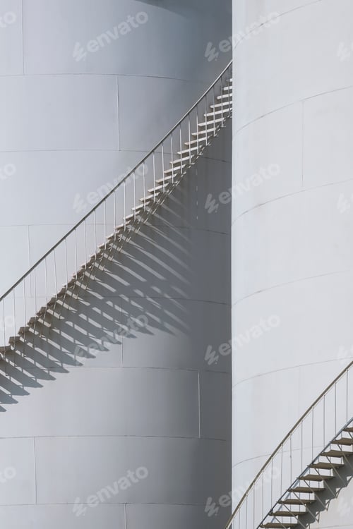 Preview: Sunlight and shadow on spiral staircases surface of 2 oil storage fuel tank in vertical frame