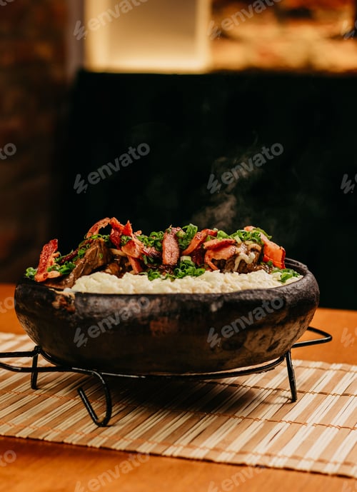 Preview: Close-up image of a bowl filled with cooked white rice and slices of cooked meat
