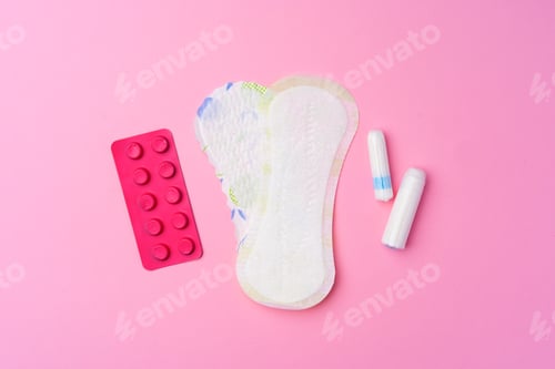 Preview: Сontraceptive pills, hygienic pads and tampons on pink background
