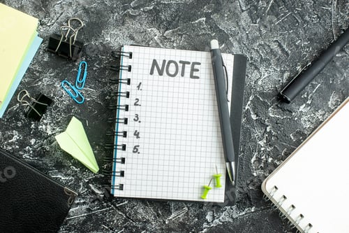 Preview: top view open notepad with note and numbers on gray background job copybook school student business