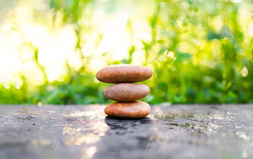 Preview: Pyramid pebbles on wood outdoor nature blur bokeh background