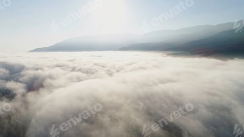Preview: Aerial view of clouds and landscape under them. Shot. Top view of the clouds under the sky. Under