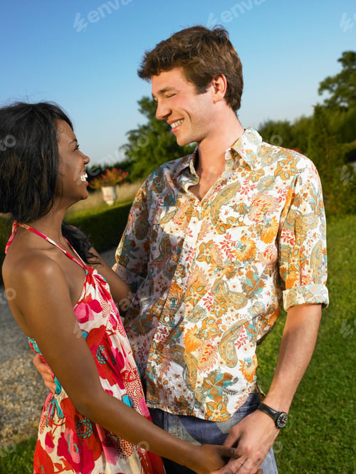 Preview: Couple smiling at sunset