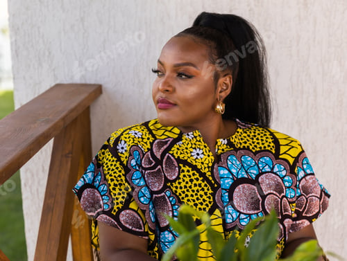 Preview: African american woman drinking tea on cozy balcony or terrace wooden country house in weekend on