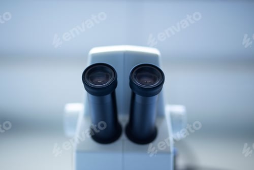 Preview: Closeup of a white microscope in a laboratory setting