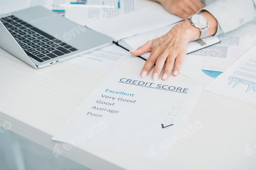 Preview: cropped view of woman showing credit score at office