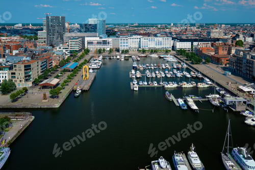 Preview: Yachts at the oldest harbor district Eilandje of Antwerp city - waterfront marina promenade, Belgium