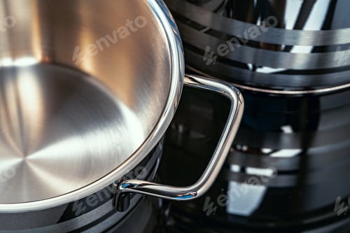 Preview: Set of aluminum pans on black surface close up