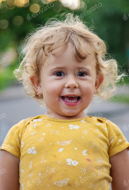 Preview: Cheerful child on the street portrait. Selective focus.