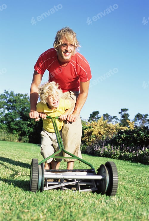 Preview: Father and son pushing lawn mower