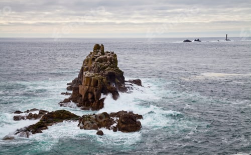 Preview: Land's End, rock islets offshore, the Penwith peninsula, view to a lighthouse and out to sea.