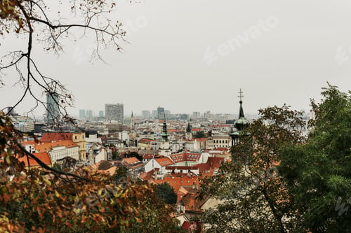 Preview: Bratislava sky line, View of St Michael's tower, among autumnal trees.