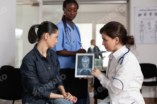 Preview: Radiologist doctor explaining clinical recovery to sick woman patient