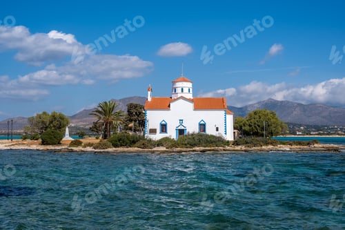 Preview: Elafonisos Peloponnese. Greece. Agios Spyridon church at island port, sunny day, blue sky