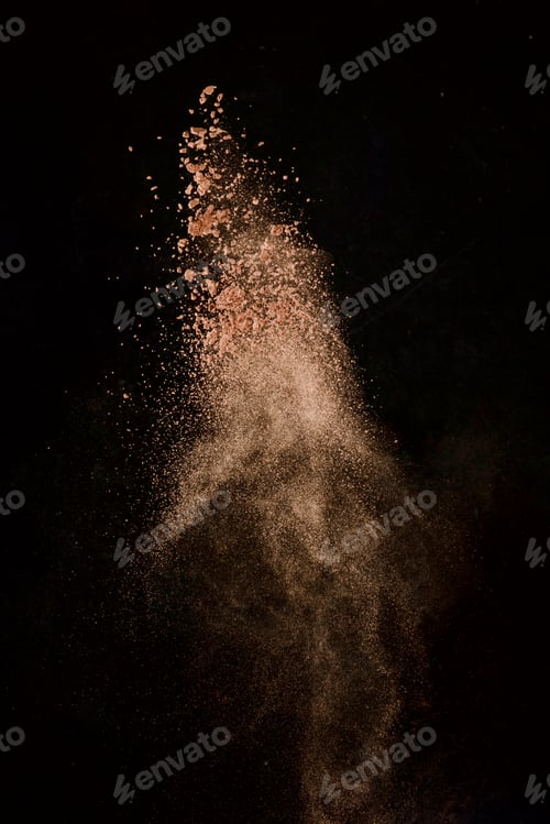Preview: Cocoa powder explosion in motion. Chocolate dust on a black background. Action food photography.